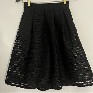 Pleaded Flared Black knee length skirt w/ pockets